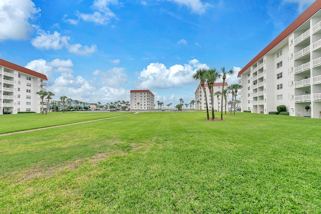 view of home's community featuring a yard