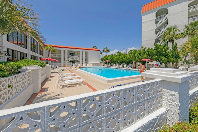 view of swimming pool featuring a patio area