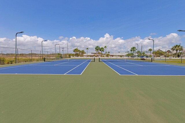 909 Santa Rosa Blvd Unit 211, Fort Walton Beach, FL 32548 - view of tennis court with community basketball court and fence