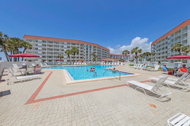 view of swimming pool featuring a patio area