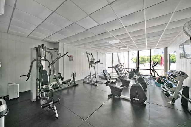 workout area with a paneled ceiling