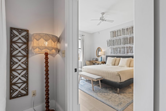 bedroom featuring wood finished floors and ceiling fan