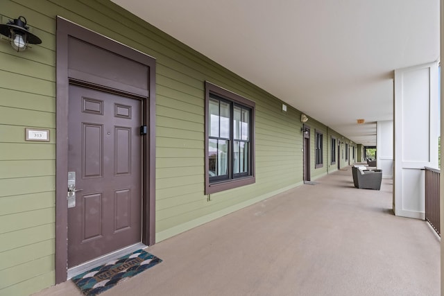 doorway to property featuring a porch