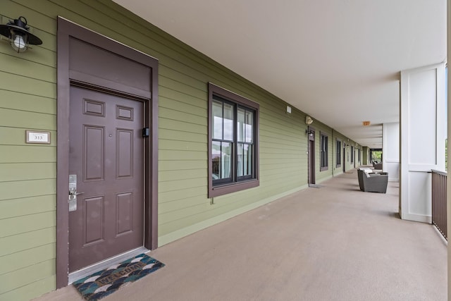 doorway to property with covered porch