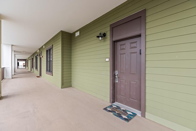 property entrance featuring a porch