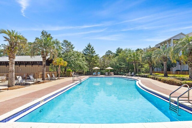 view of swimming pool with a patio