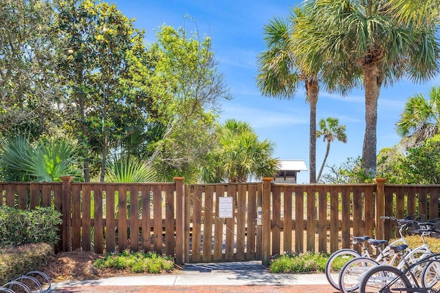 view of gate with fence