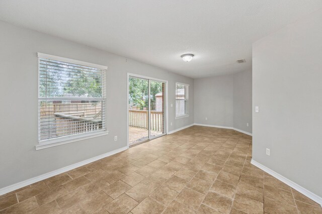 spare room featuring a textured ceiling