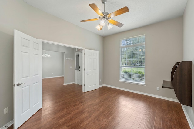 unfurnished bedroom featuring a textured ceiling, ceiling fan, and dark hardwood / wood-style floors