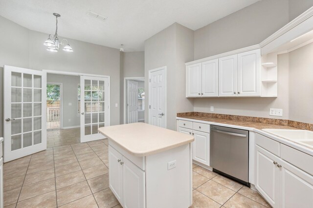 kitchen with dishwasher, french doors, white cabinets, and hanging light fixtures