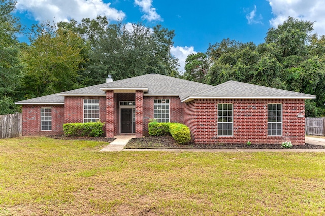 single story home featuring a front lawn