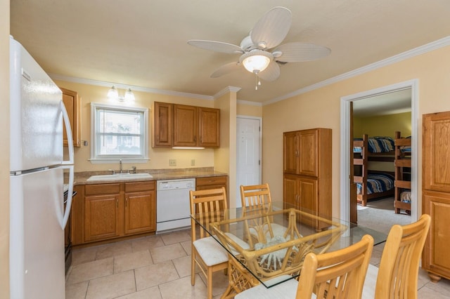 kitchen featuring ornamental molding, white appliances, light tile patterned floors, sink, and ceiling fan