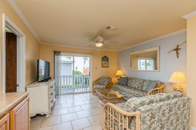 tiled living room featuring crown molding and ceiling fan