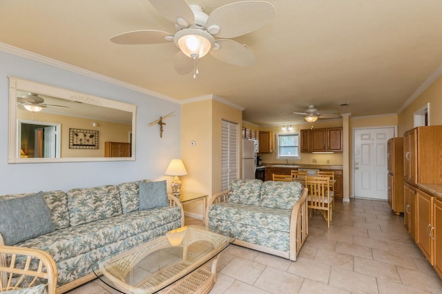 living room with crown molding, ceiling fan, sink, and light tile patterned floors