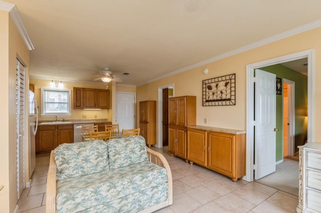 kitchen featuring crown molding, sink, light tile patterned flooring, ceiling fan, and stainless steel dishwasher