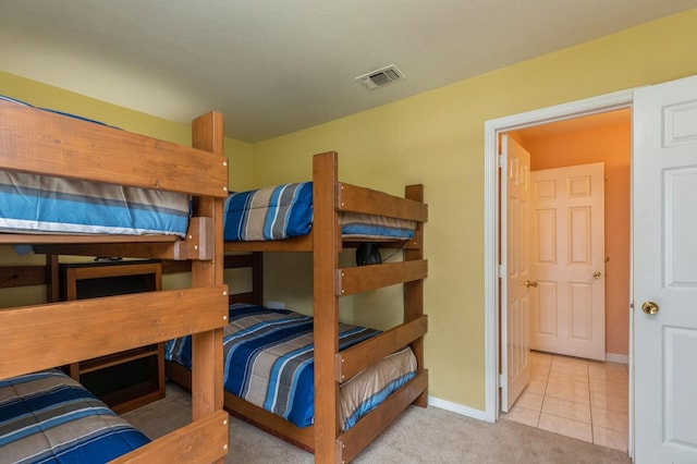 bedroom featuring light colored carpet