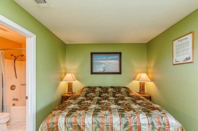 tiled bedroom with connected bathroom