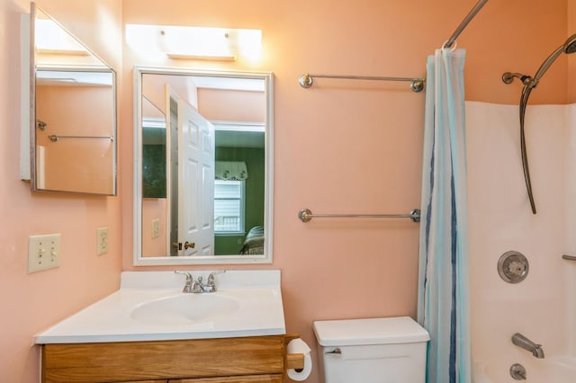 full bathroom featuring vanity, toilet, and shower / tub combo