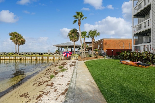 view of yard with a water view and a balcony