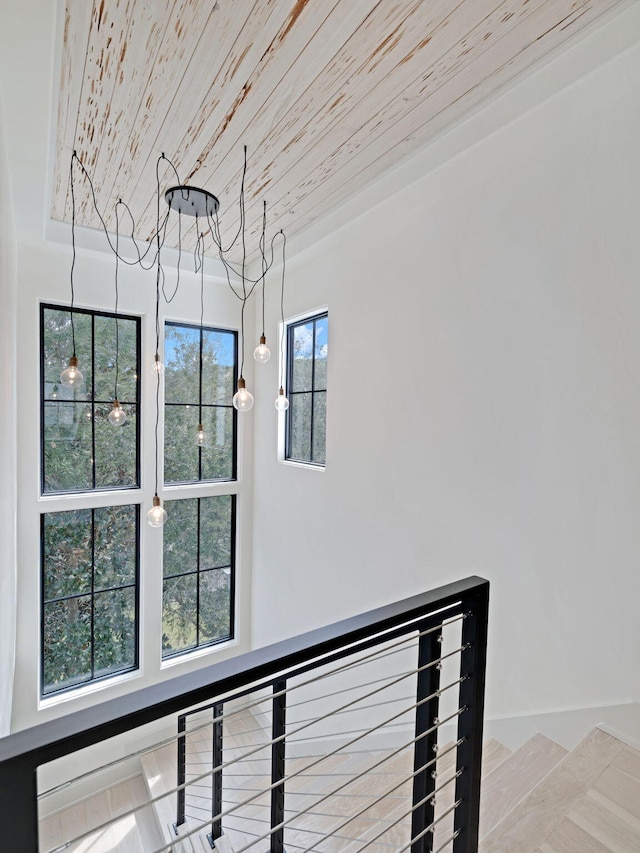 interior details with wood-type flooring and wood ceiling