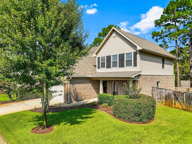 front of property with a garage and a front yard