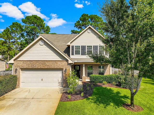 front of property featuring a front yard, a garage, and a porch