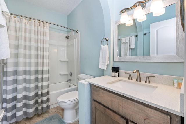 full bathroom featuring a textured ceiling, vanity, shower / tub combo, toilet, and tile patterned floors