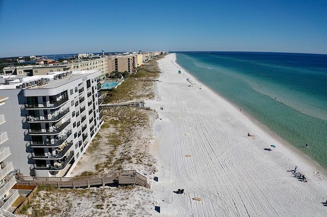 aerial view featuring a water view and a view of the beach