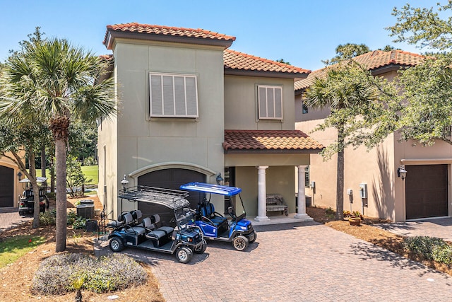 mediterranean / spanish house with a garage