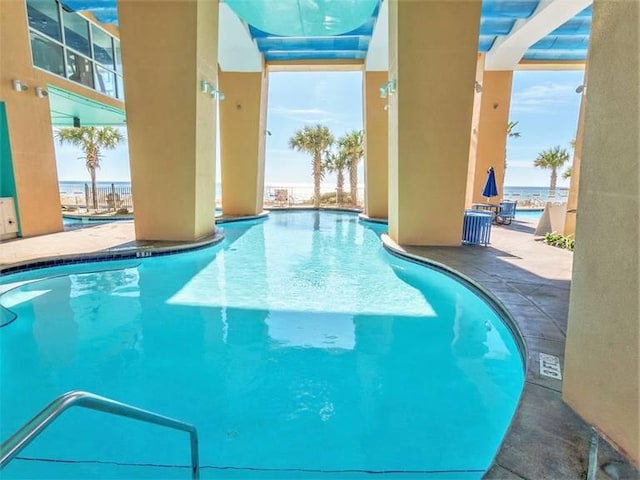 view of swimming pool with a patio area