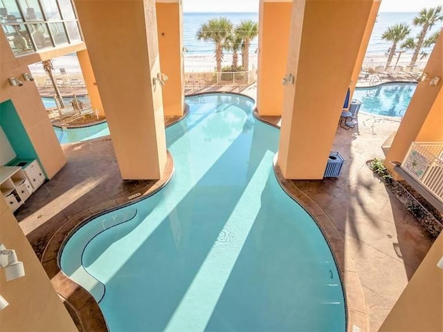 view of swimming pool with a patio area