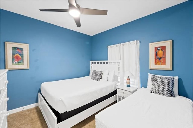 bedroom featuring ceiling fan and light colored carpet