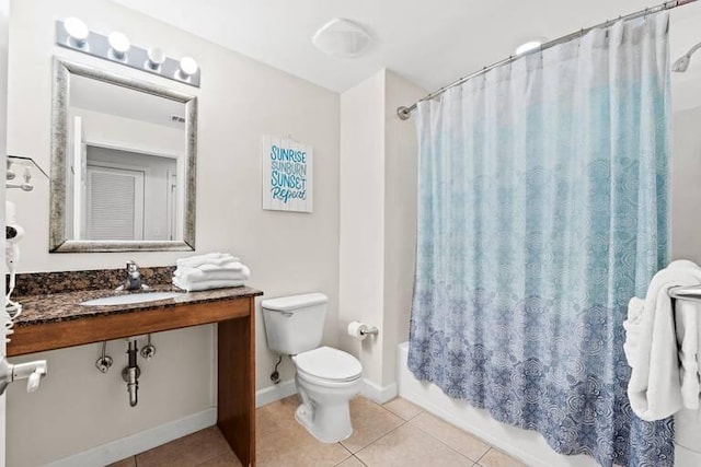 full bathroom featuring vanity, shower / tub combo, toilet, and tile patterned flooring