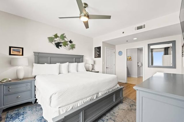 bedroom featuring light hardwood / wood-style floors and ceiling fan