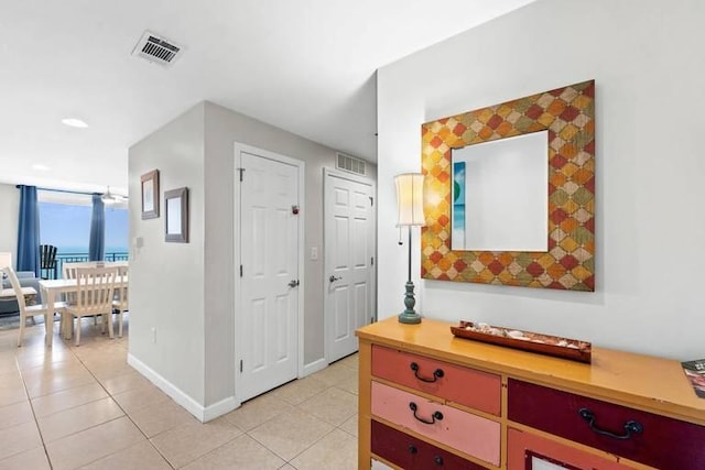 hallway with light tile patterned flooring