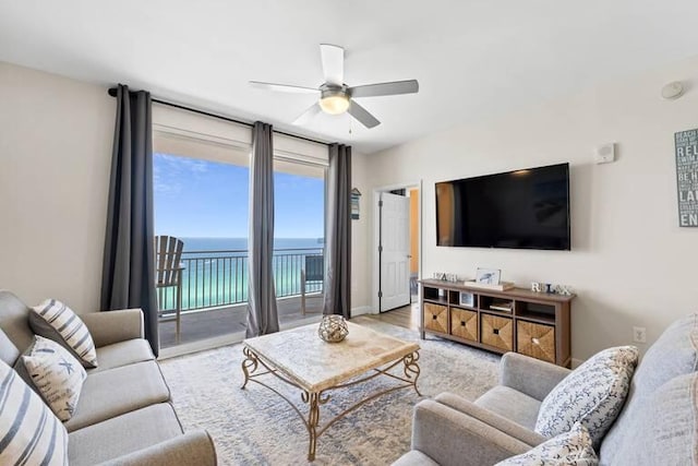 living room featuring ceiling fan and light hardwood / wood-style flooring