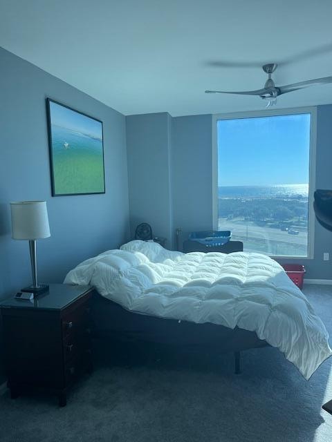 carpeted bedroom with ceiling fan