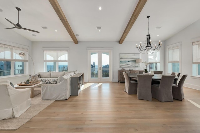 dining space featuring visible vents, beamed ceiling, and light wood-style flooring