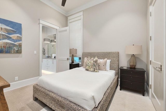 bedroom featuring ceiling fan, ornamental molding, light wood-type flooring, and connected bathroom