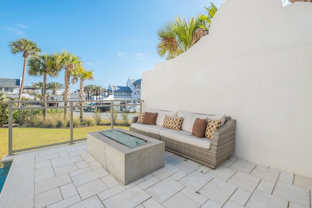 view of patio / terrace with an outdoor fire pit