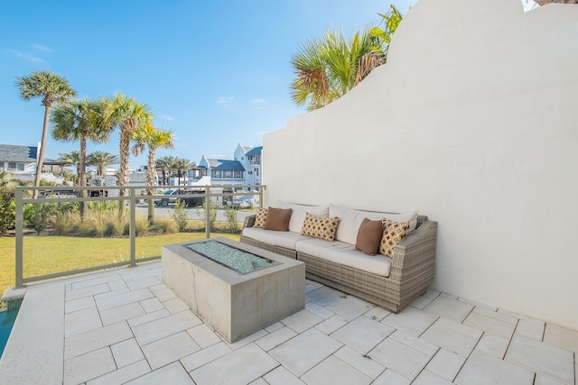 view of patio featuring a residential view and an outdoor living space with a fire pit