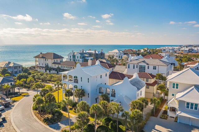 drone / aerial view with a residential view and a water view