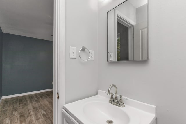 bathroom featuring hardwood / wood-style flooring and vanity