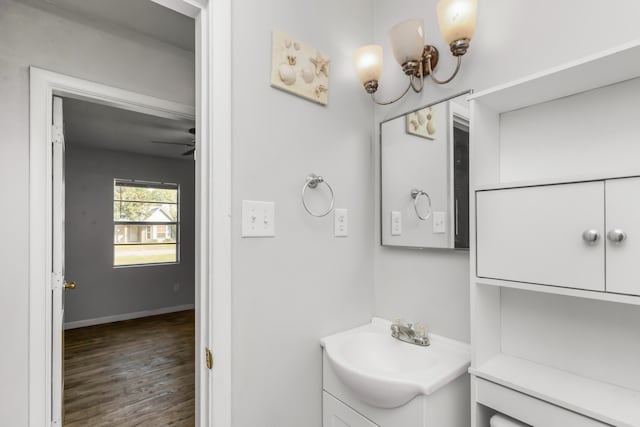 bathroom featuring hardwood / wood-style floors, ceiling fan, and vanity