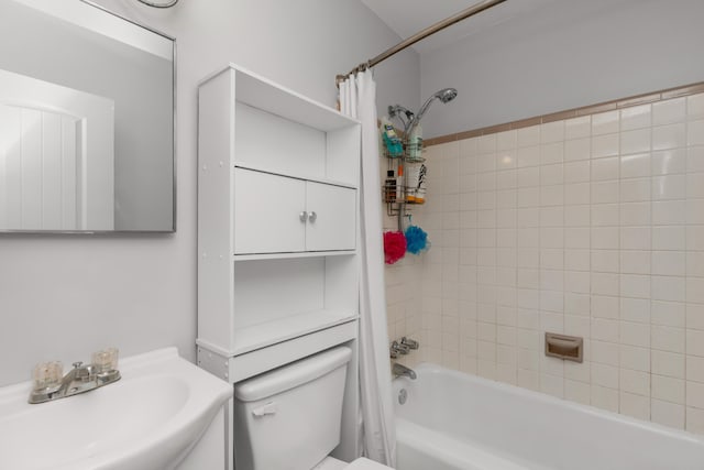 full bathroom with sink, toilet, and shower / bathtub combination with curtain