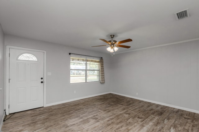 entryway featuring ceiling fan, ornamental molding, and hardwood / wood-style floors