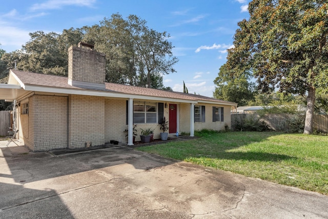 ranch-style house with a front yard