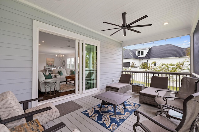 wooden deck featuring an outdoor hangout area and ceiling fan