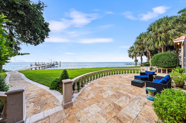 view of patio / terrace featuring a dock and a water view