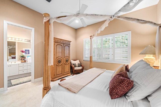 carpeted bedroom featuring ensuite bath and ceiling fan